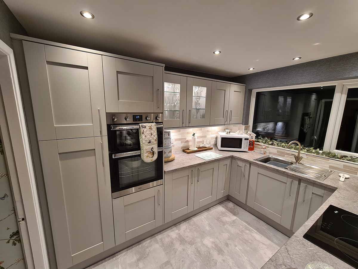 Grey Shaker kitchen with a built-in double oven